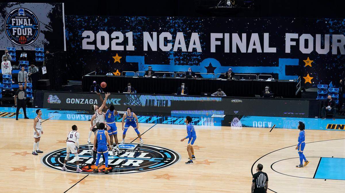 Gonzaga and UCLA tip off to start the second game of the NCAA Final Four last April in Indianapolis. Because of the pandemic, last year’s NCAA Tournament was conducted entirely in one state.