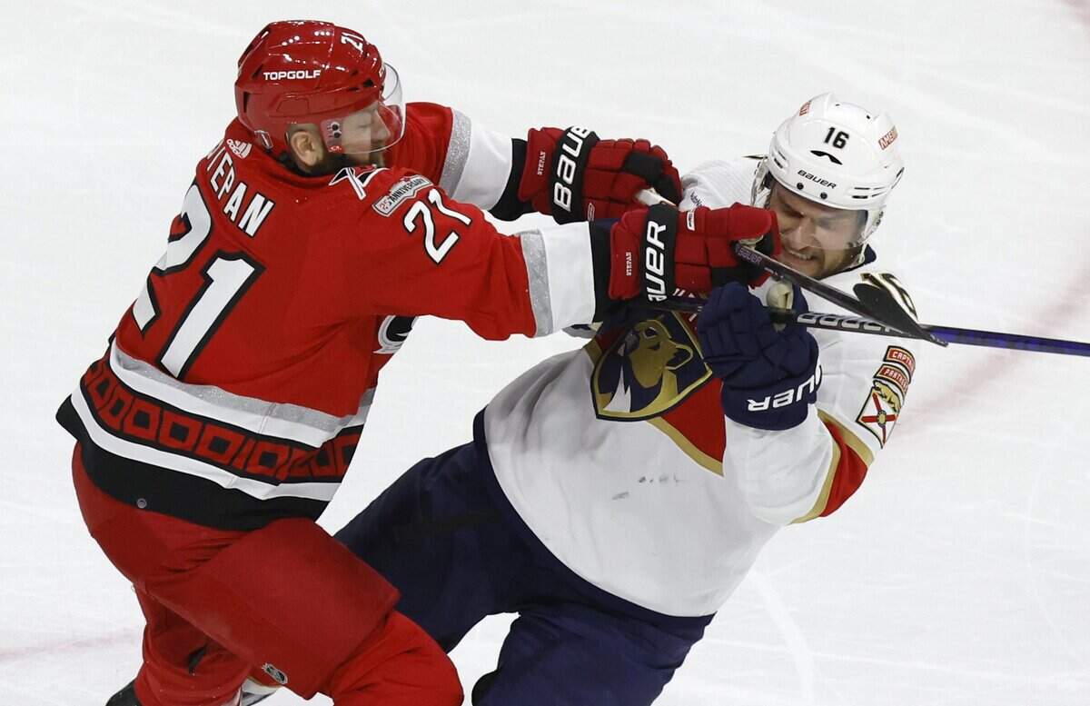 Carolina center Derek Stepan (21) hits Florida center Aleksander Barkov (16) during the second period of the Hurricanes’ game against the Panthers in the first game of Eastern Conference Finals at PNC Arena in Raleigh, N.C., on Thursday, May 18, 2023.
