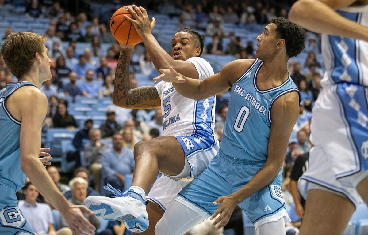 North Carolina’s Armando Bacot (5) secures an offensive rebound against The Citadel’s Jackson Price (0) in the first half on Tuesday, December 13, 2022 at the Smith Center in Chapel Hill, N.C. Bacot secured 11 rebounds and scored 13 points, setting a North Carolina record for double digit rebounding in 62 games.