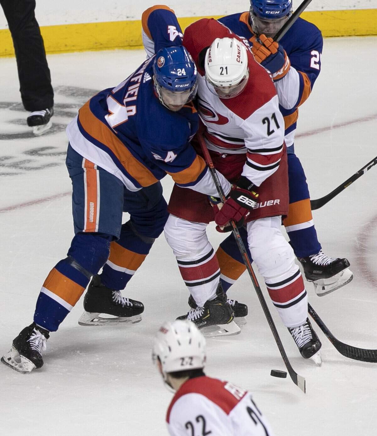 Carolina Hurricanes’ Nino Niederreiter (21) works to control the puck against New York Islanders’ Scott Mayfield (24) in the first period during Game 1 of the second round Stanley Cup series on Friday, April 26, 2019 at Barclays Center in Brooklyn, N.Y.