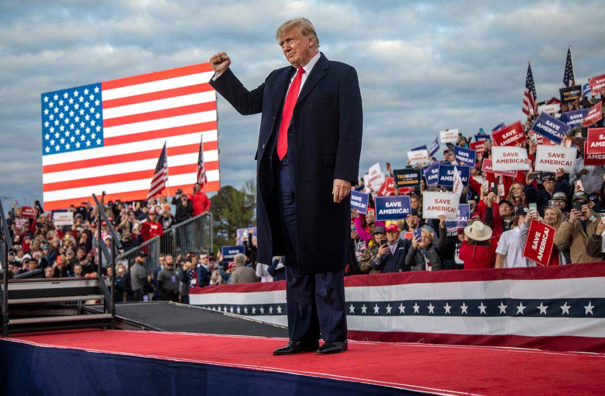Former President Donald Trump takes the stage during a rally in Selma Saturday, April 9, 2022.