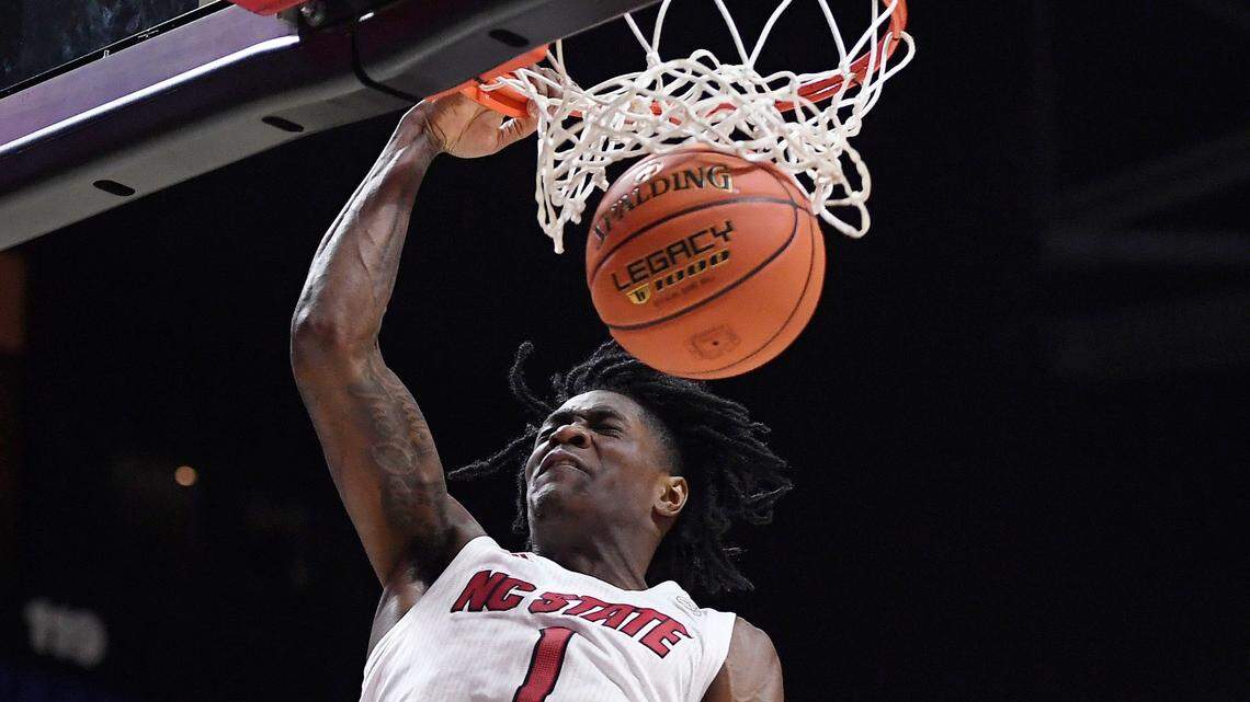 North Carolina State’s Dereon Seabron (1) dunks the ball in the first half of an NCAA college basketball game against Oklahoma State, Wednesday, Nov. 17, 2021, in Uncasville, Conn. (AP Photo/Jessica Hill)