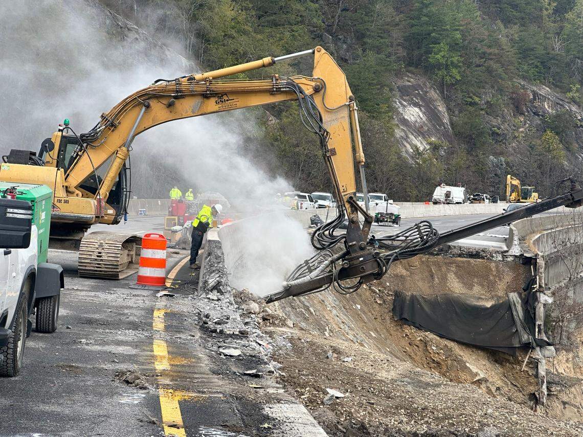 Contractors drill long steel rods into the ground under the westbound lanes of Interstate 40 in Pigeon River Gorge on Wednesday, Oct. 16, 2024. The rods will help stabilize what’s left of the road, so contractors can begin rebuilding the eastbound lanes washed out by the remnants of Hurricane Helene.