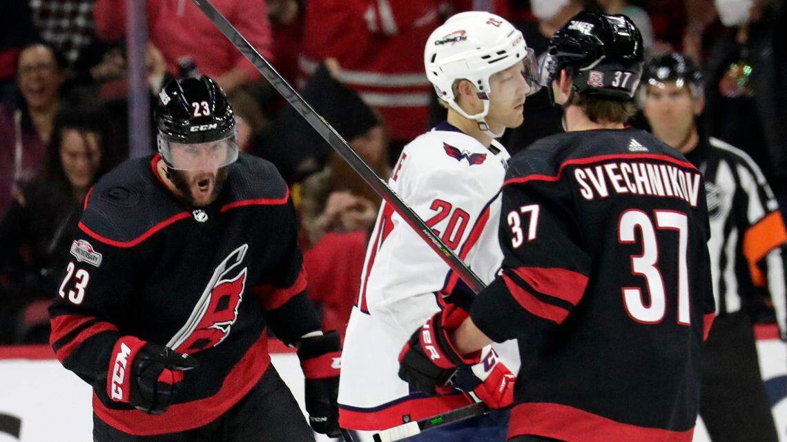 Carolina Hurricanes right wing Stefan Noesen (23) celebrates after his goal with right wing Andrei Svechnikov (37) while Washington Capitals center Lars Eller (20) skates away during the first period of an NHL hockey game Monday, Oct. 31, 2022, in Raleigh, N.C.