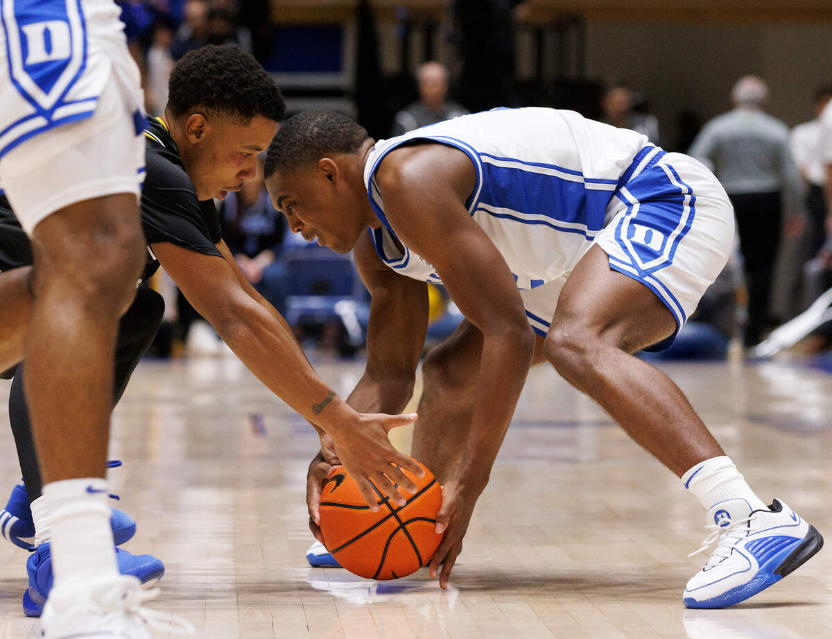 Duke’s Jaylen Blakes handles the ball under pressure from La Salle’s Jhamir Brickus during the second half of the Blue Devils’ 95-66 win on Tuesday, Nov. 21, 2023, at Cameron Indoor Stadium in Durham, N.C.
