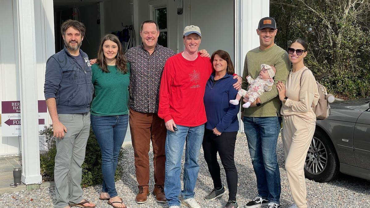 House hunting in December 2022 ... (front left to right) Jeff Gula, Jenn Summe, Plum founder Matt Williamson, Tim Pflaum, Hope Pflaum, Mark Russell (with baby Aubrey), Fara Russell.