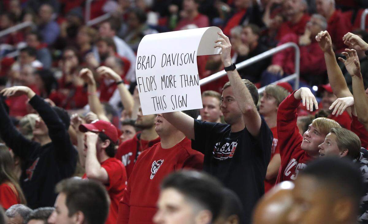 A Wolfpack fan lets his feelings be known during the second half of N.C. State’s 69-54 victory over Wisconsin at PNC Arena in Raleigh, N.C., Wednesday, Dec. 4, 2019.