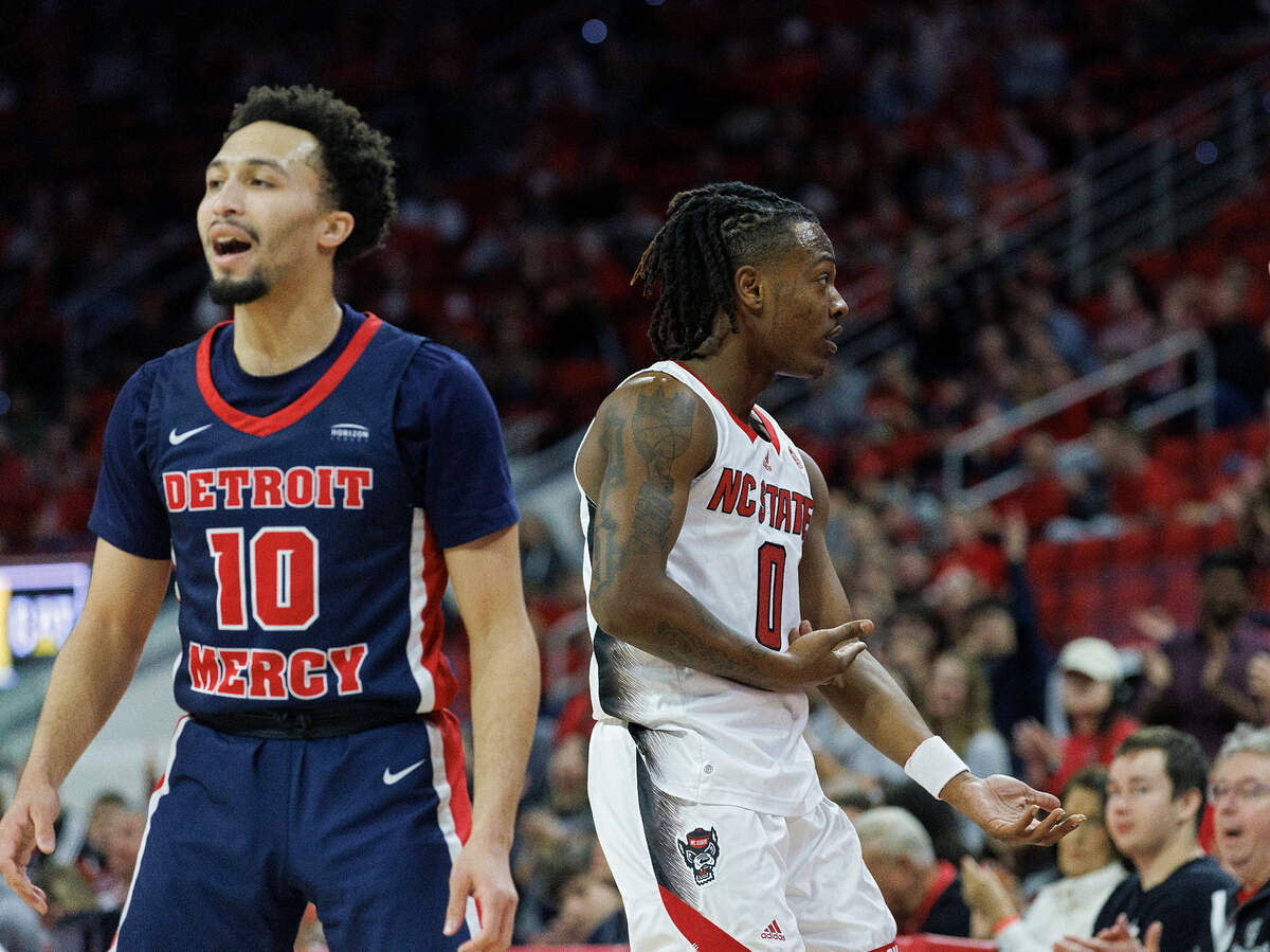 N.C. State’s DJ Horne celebrates after knocking down a three-point basket during the first half of the Wolfpack’s 83-66 win over Detroit on Saturday, Dec. 23, 2023, at PNC Arena in Raleigh, N.C.