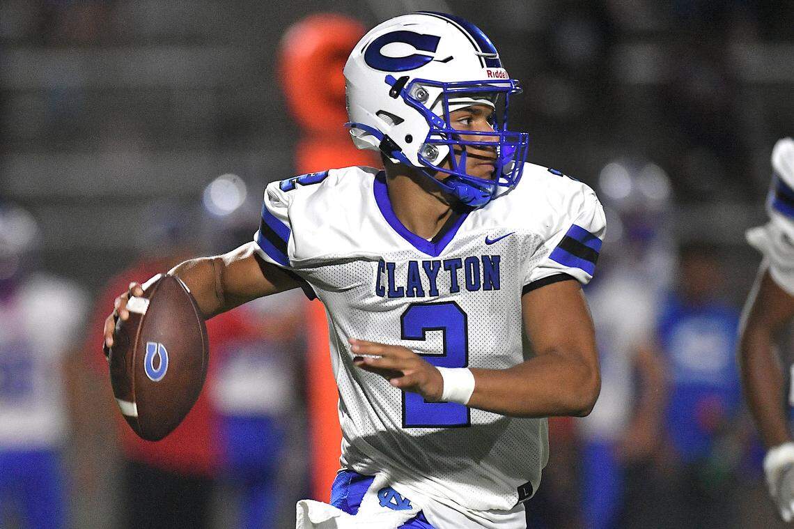 Clayton quarterback Aiden Smalls (2)  looks to pass downfield against Wake Forest during the first half. The Wake Forest Cougars and the Clayton Comet met in a non-conference football game in Wake Forest, N.C. on August 23, 2024.