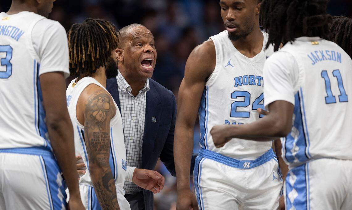 Down by 12 points against Florida, North Carolina coach Hubert Davis huddles with his players during a time out on Tuesday, December 17, 2024 at the Spectrum Center in Charlotte, N.C.