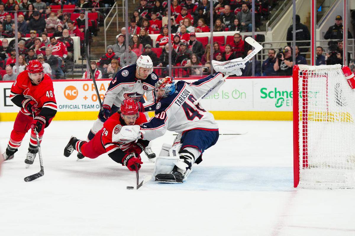 Carolina Hurricanes center Seth Jarvis (24) misses on his shot attempt against Columbus Blue Jackets goaltender Daniil Tarasov (40) during the first period at Lenovo Center.