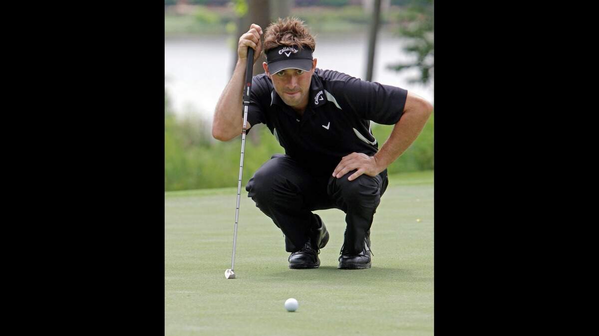 Ty Tryon lines up a putt as he plays a practice round at TPC Wakefield in Raleigh, NC on May 27, 2011.  He went pro at 17 and played two years on the PGA Tour.