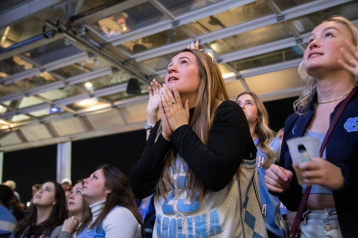 UNC basketball fans watch the NCAA Championship game against Kansas at Top of the Hill Restaurant & Brewery in Chapel Hill Monday, April 4, 2022.