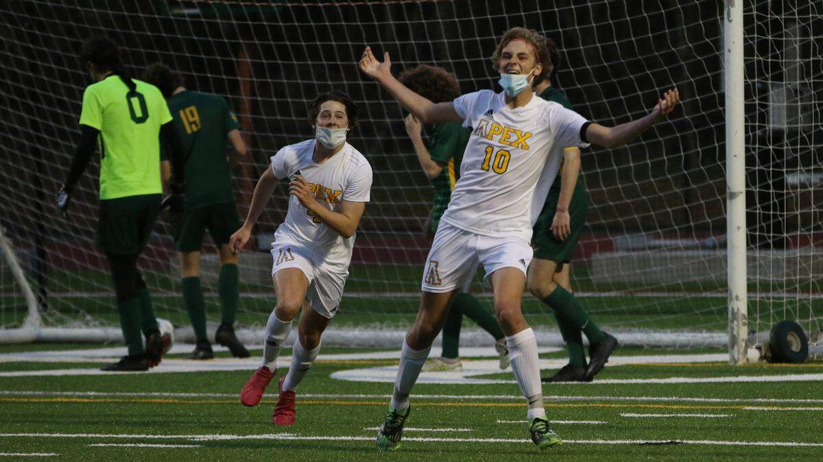 Apex High School junior captain and midfielder Jake Shannon (10) celebrates after scoring a goal to tie the score in the second half.