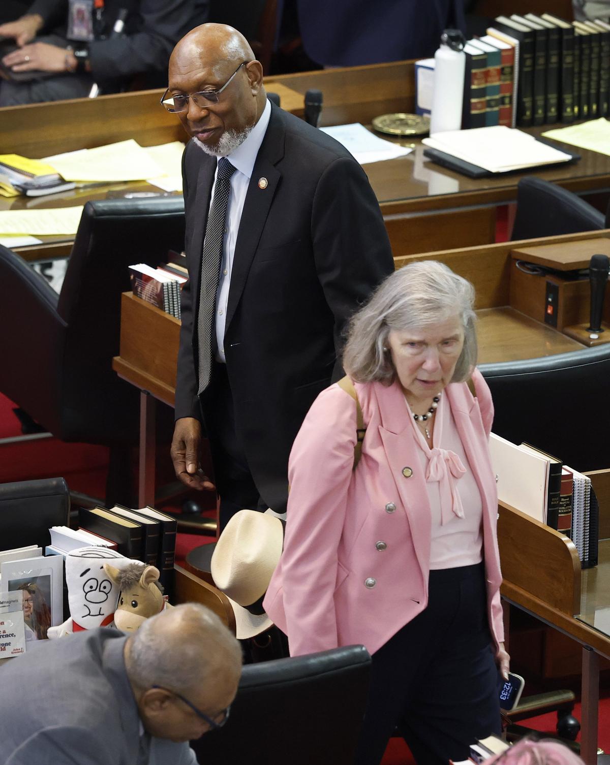 Rep. Becky Carney walks away after talking with  Rep. Shelly Willingham after the N.C. House took a break for lunch at the Legislative Building in Raleigh, N.C., Tuesday, July 29, 2025.