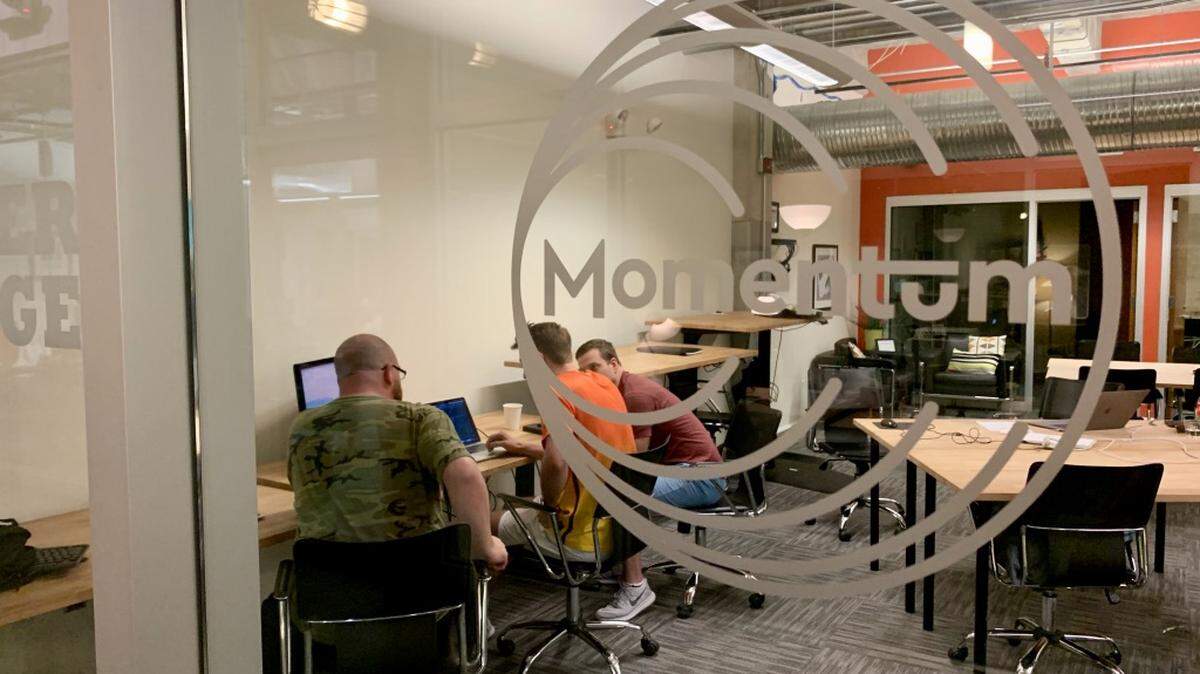 Students at Momentum coding school work on their final projects.
