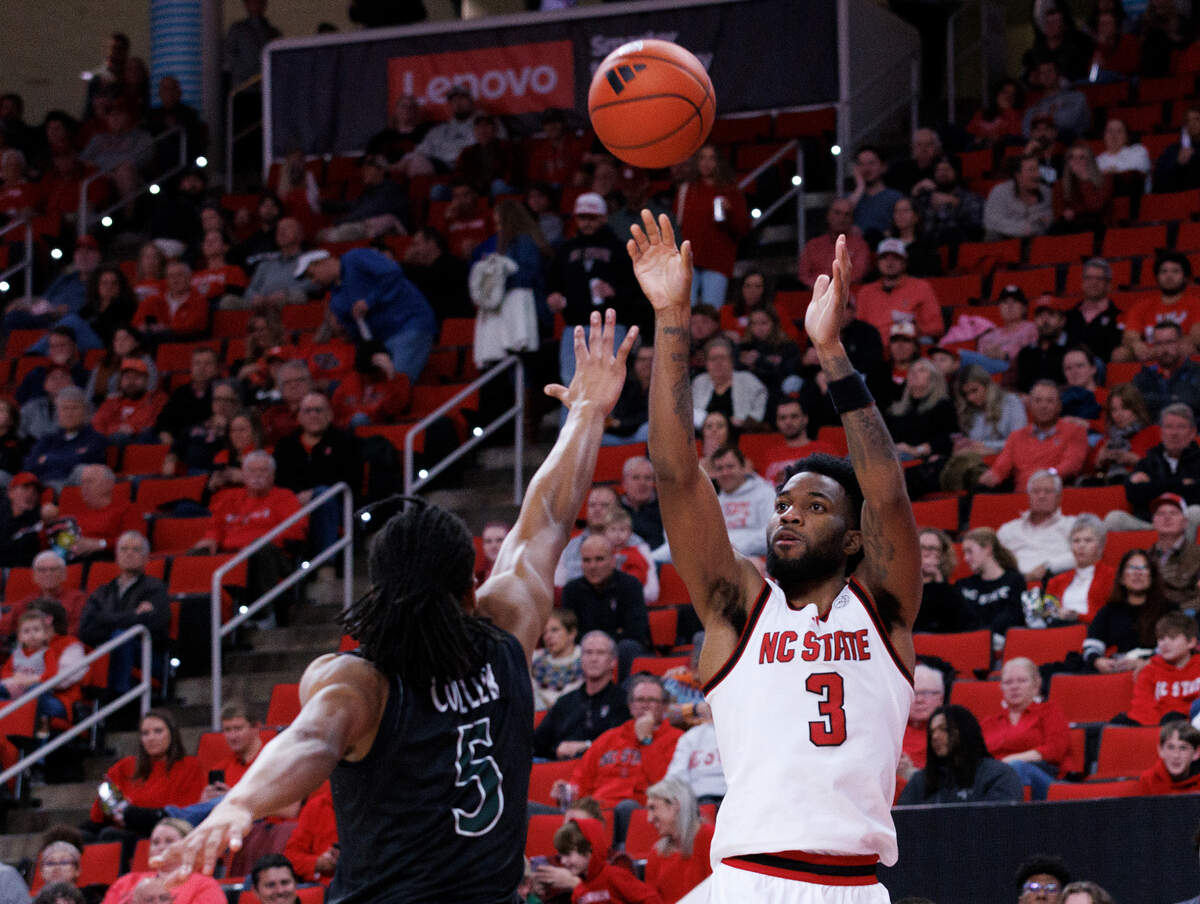 N.C. State’s Dontrez Styles shoots over William & Mary’s Noah Collier during the first half of the Wolfpack’s 84-61 win at Lenovo Center on Friday, Nov. 22, 2024, in Raleigh, N.C.