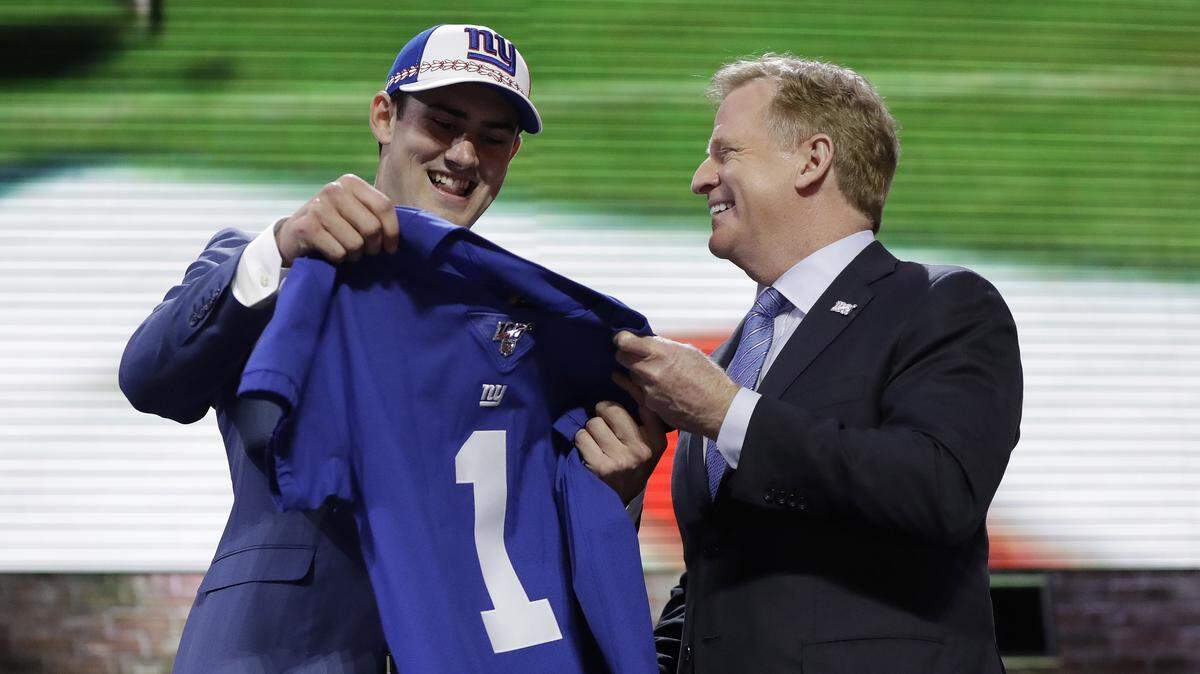 Duke quarterback Daniel Jones poses with NFL Commissioner Roger Goodell after the New York Giants selected Jones in the first round at the NFL football draft, Thursday, April 25, 2019, in Nashville, Tenn. (AP Photo/Mark Humphrey)