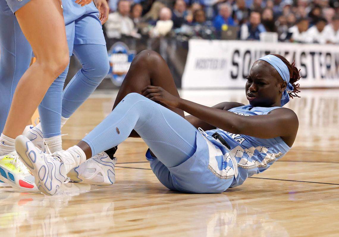 North Carolina’s Maria Gakdeng reacts after going down with an apparent injury during the first half of the Tar Heels’ NCAA Tournament Sweet 16 matchup against Duke at Legacy Arena on Friday, March 28, 2025, in Birmingham, Ala.