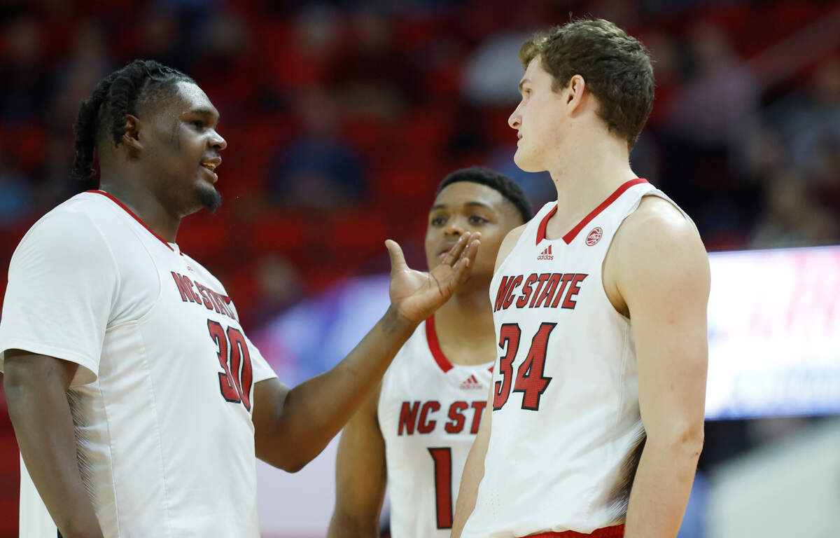 N.C. State’s DJ Burns Jr. (30) talks with Ben Middlebrooks (34) during the second half of N.C. State’s 81-67 victory over UT Martin at PNC Arena in Raleigh, N.C., Tuesday, Dec. 12, 2023.