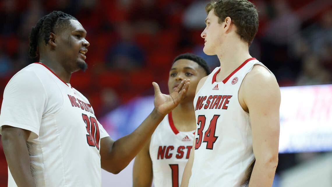 N.C. State’s DJ Burns Jr. (30) talks with Ben Middlebrooks (34) during the second half of N.C. State’s 81-67 victory over UT Martin at PNC Arena in Raleigh, N.C., Tuesday, Dec. 12, 2023.