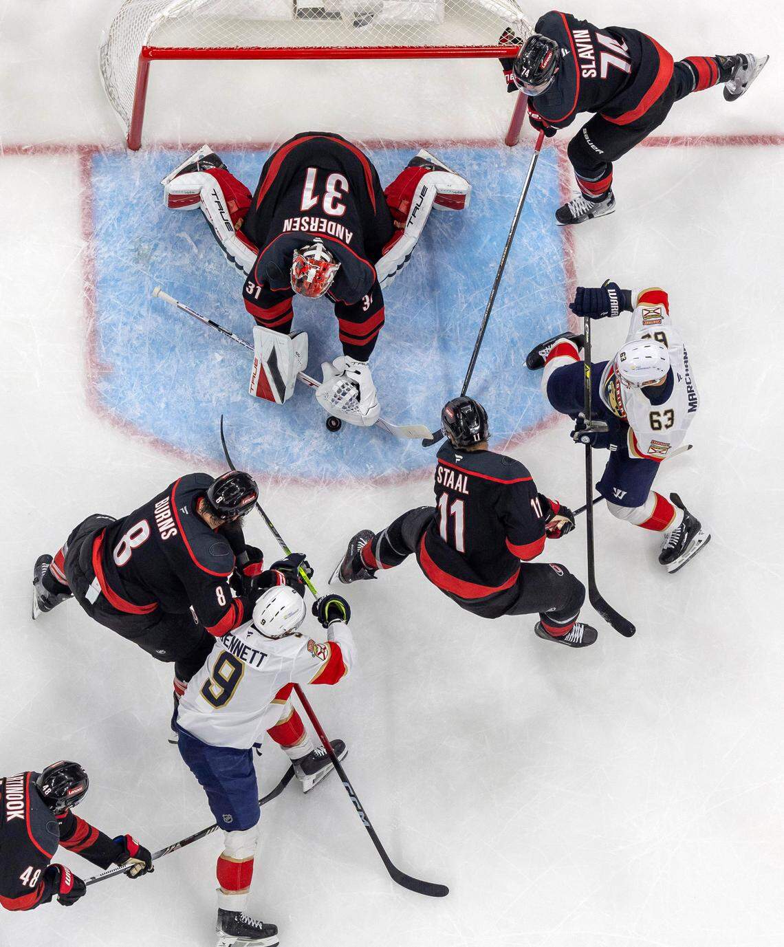 Carolina Hurricanes goalie Frederik Andersen (31) stops a scoring attempt by Florida Panthers center Sam Bennett (9) in the first period of their Stanley Cup series on Wednesday, May 28, 2025 at Lenovo Center in Raleigh, N.C.