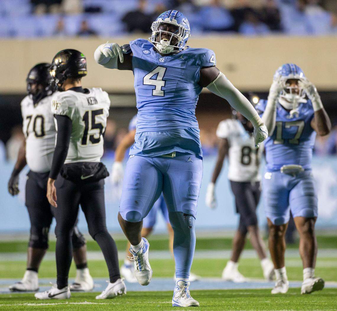 North Carolina defensive lineman Travis Shaw (4) reacts after stopping Wake Forest running back Demond Claiborne for a three-yard loss in the third quarter on Saturday, November 16, 2024 at Kenan Stadium in Chapel Hill, N.C.