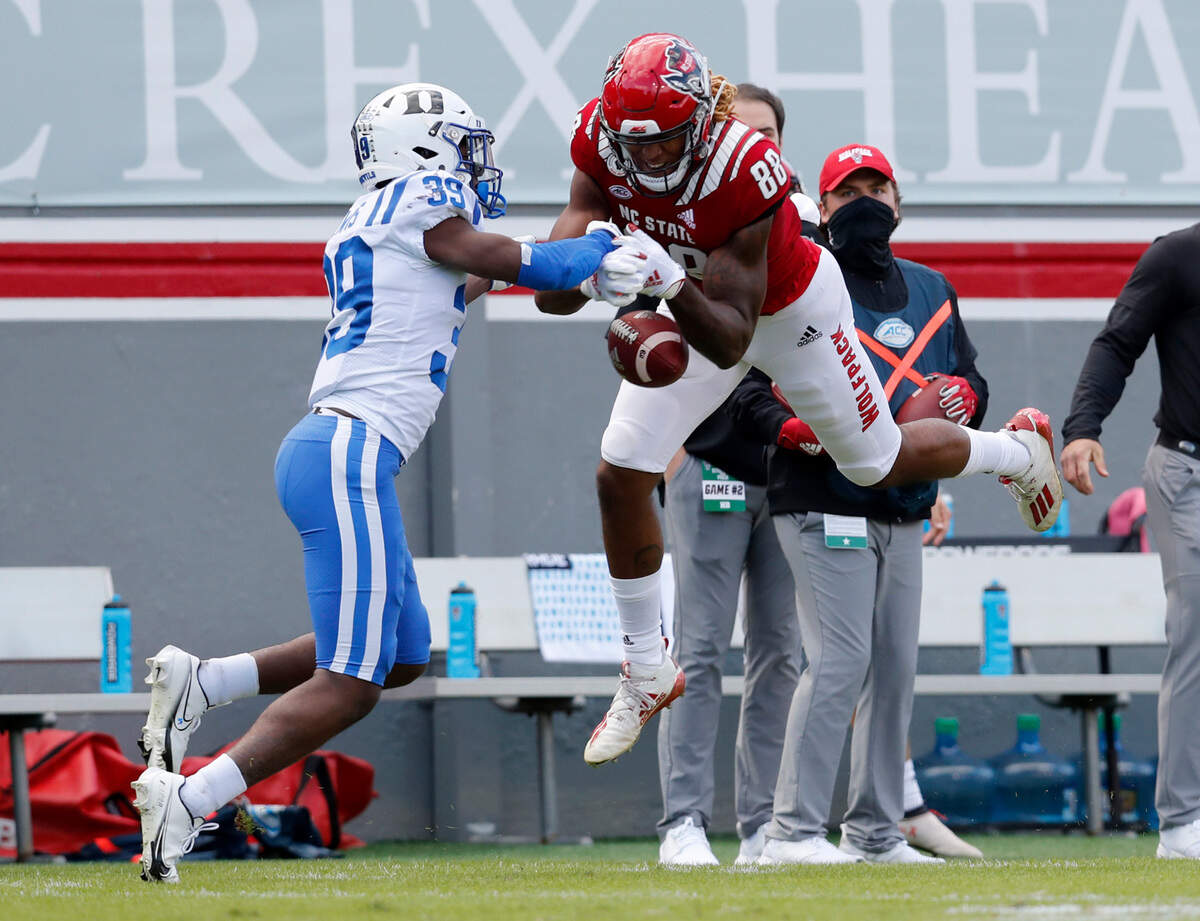 N.C. State wide receiver Devin Carter (88) can’t pull in the pass while defended by Duke cornerback Jeremiah Lewis (39) during the first half of N.C. State’s game against Duke at Carter-Finley Stadium in Raleigh, N.C., Saturday, Oct. 17, 2020.