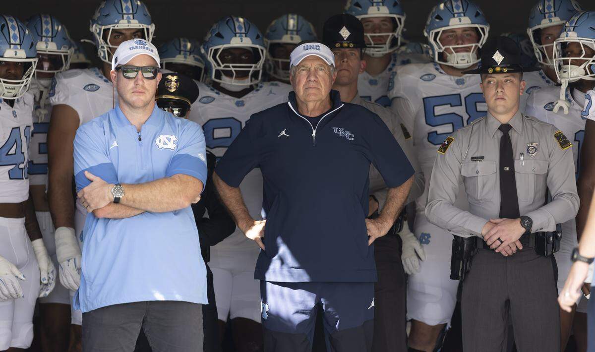 North Carolina coach Bill Belichick waits to enter Acrisure Bounce House Stadium with his players for the Tar Heels’ game against UCF on Saturday, September 20, 2025  in Orlando, Fla.