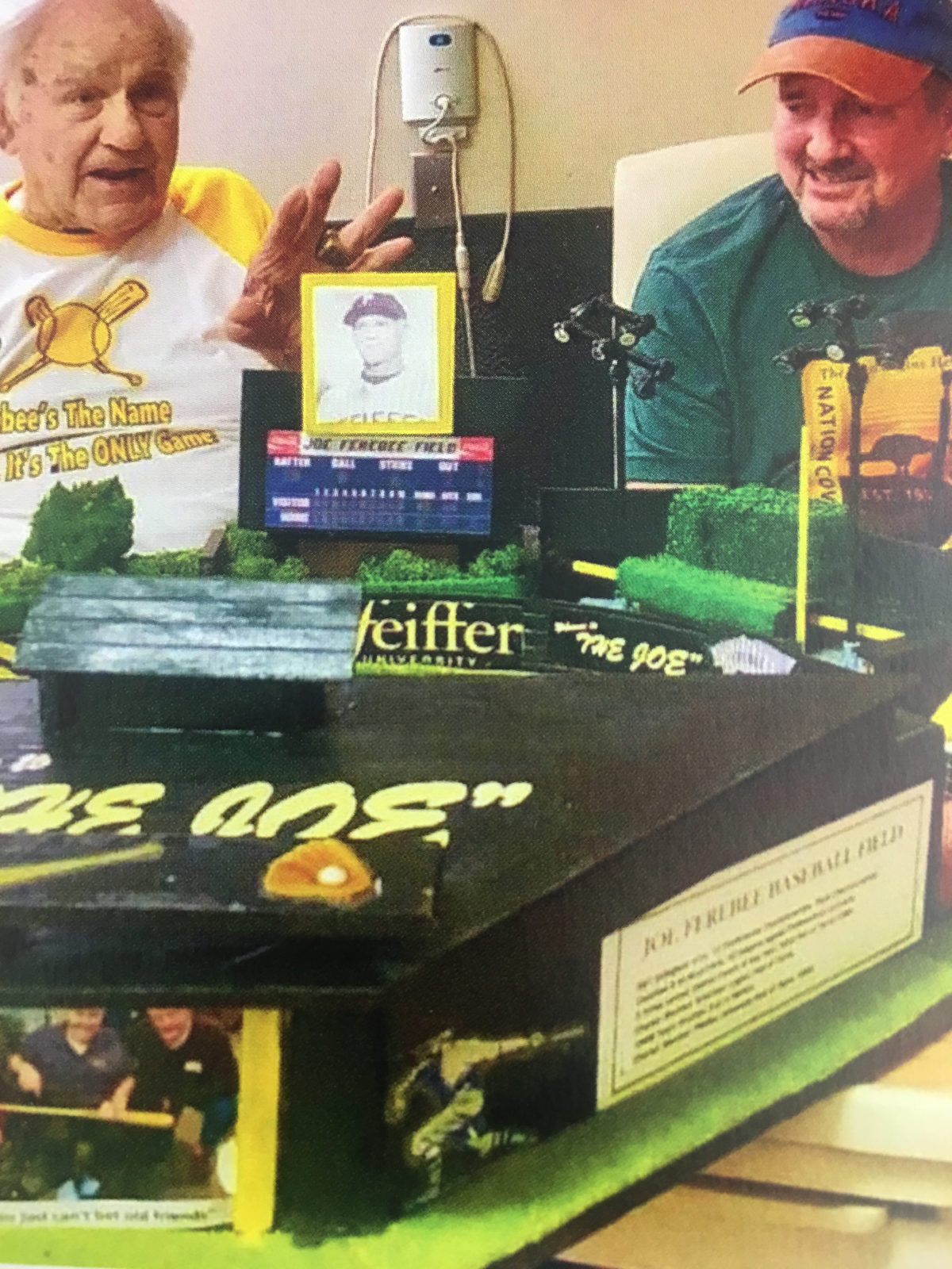 Barry Roberson, 61, and Coach Joe Ferebee from Pfeiffer University, for whom he built a miniature baseball stadium on his 100th birthday.