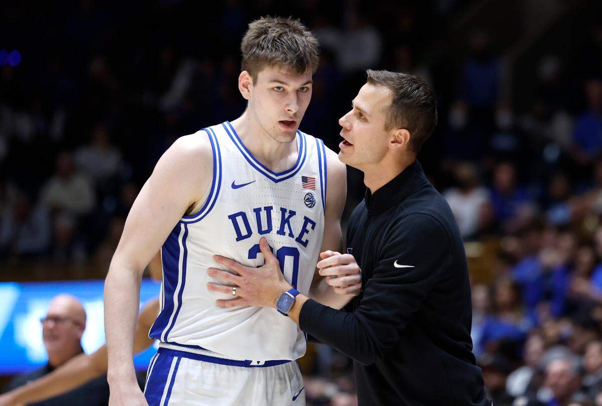 Duke head coach Jon Scheyer talks with Kyle Filipowski (30) during the second half of Duke’s 75-73 victory over Wake Forest at Cameron Indoor Stadium in Durham, N.C., Tuesday, Jan. 31, 2023.