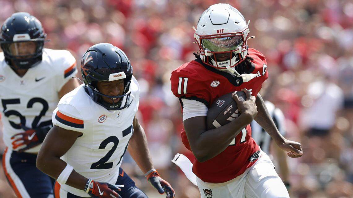 N.C. State quarterback CJ Bailey (11) breaks free to score on a 30-yard touchdown run during the first half of N.C. State’s game against Virginia at Carter-Finley Stadium in Raleigh, N.C., Sat. Sept. 6, 2025.