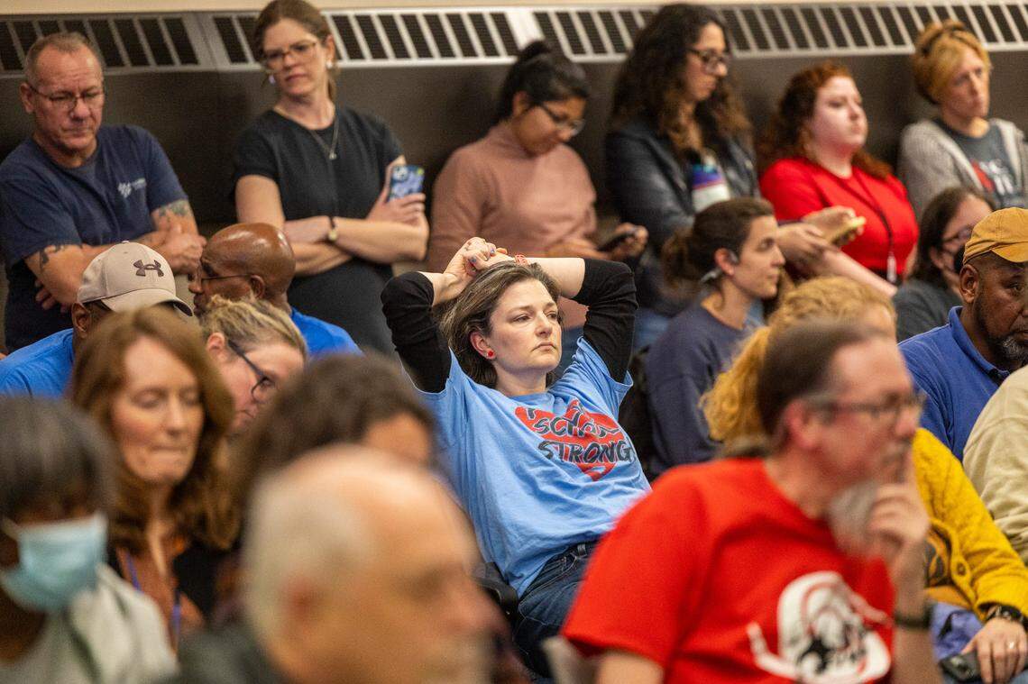 A Durham Public Schools Board of Education meeting audience listens to board members debate Friday afternoon, February 2, 2024, at the Staff Development Center in Durham. DPS struggled to resolve salary issues that plunged the district into chaos. The issues stem from an accounting error that resulted in administration withdrawing raises promised to 1,300 school staff, prompting protests and strikes since mid-January.