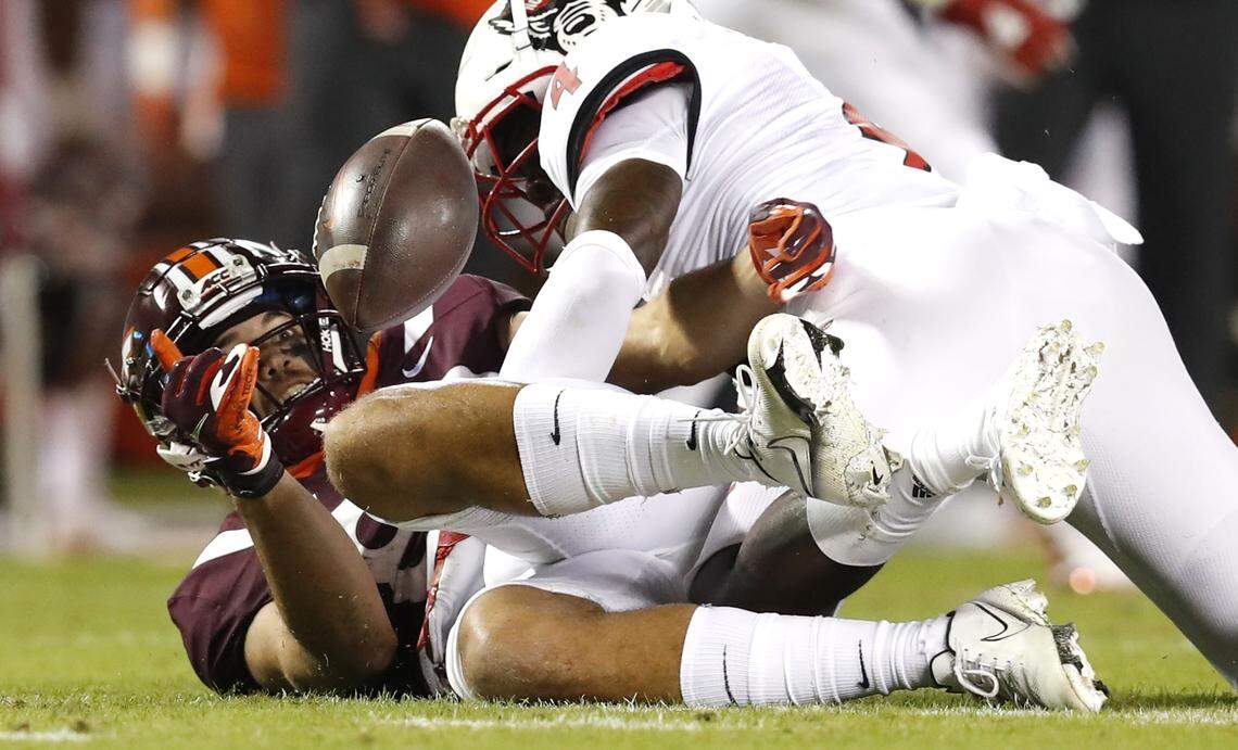 Virginia Tech wide receiver Kaleb Smith (80) keeps his eyes on the ball while making a reception as N.C. State cornerback Cecil Powell (4) defends during the first half of N.C. State’s game against Virginia Tech at Lane Stadium in Blacksburg, VA Saturday, Sept. 26, 2020.