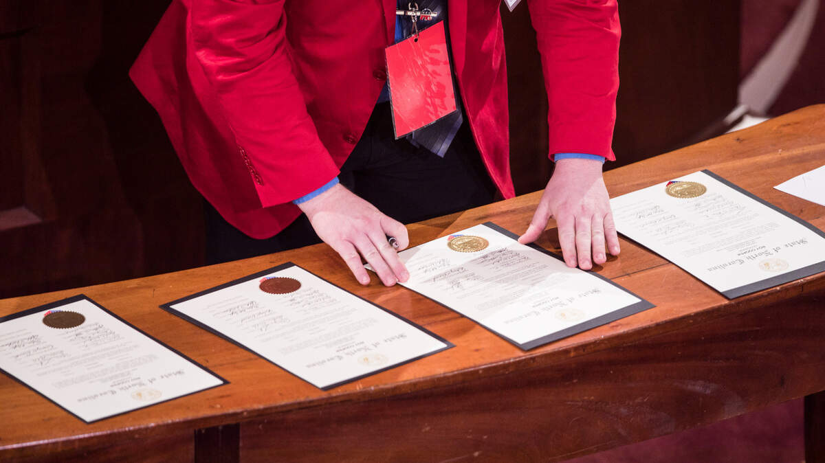 North Carolina elector Thomas William Hill prepares to sign Electoral College votes for President Donald Trump and Vice President Mike Pence in the House chambers of the Old State Capitol building in Raleigh, N.C. on Monday, December 14, 2020.