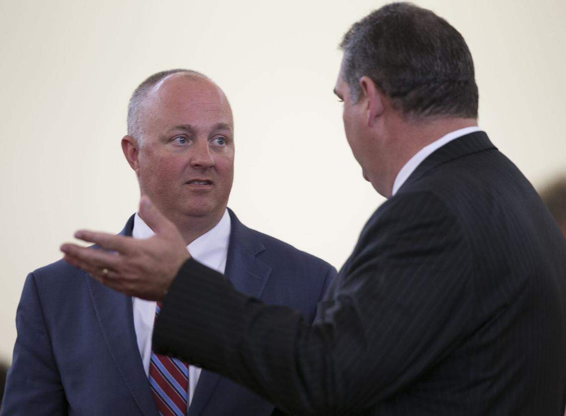 Rep. David R. Lewis, right, confers with Rep. Darren G. Jackson  during the first extra session of the Legislature on Tuesday, July 24, 2018 in Raleigh, N.C. Lawmakers were called back to Raleigh to write captions for constitutional amendments for the November election ranging from voter ID, income tax, judicial vacancies and governor's power. Lewis is the sponsor of the legislation, and Jackson voiced his opposition to the handling of the extra session.