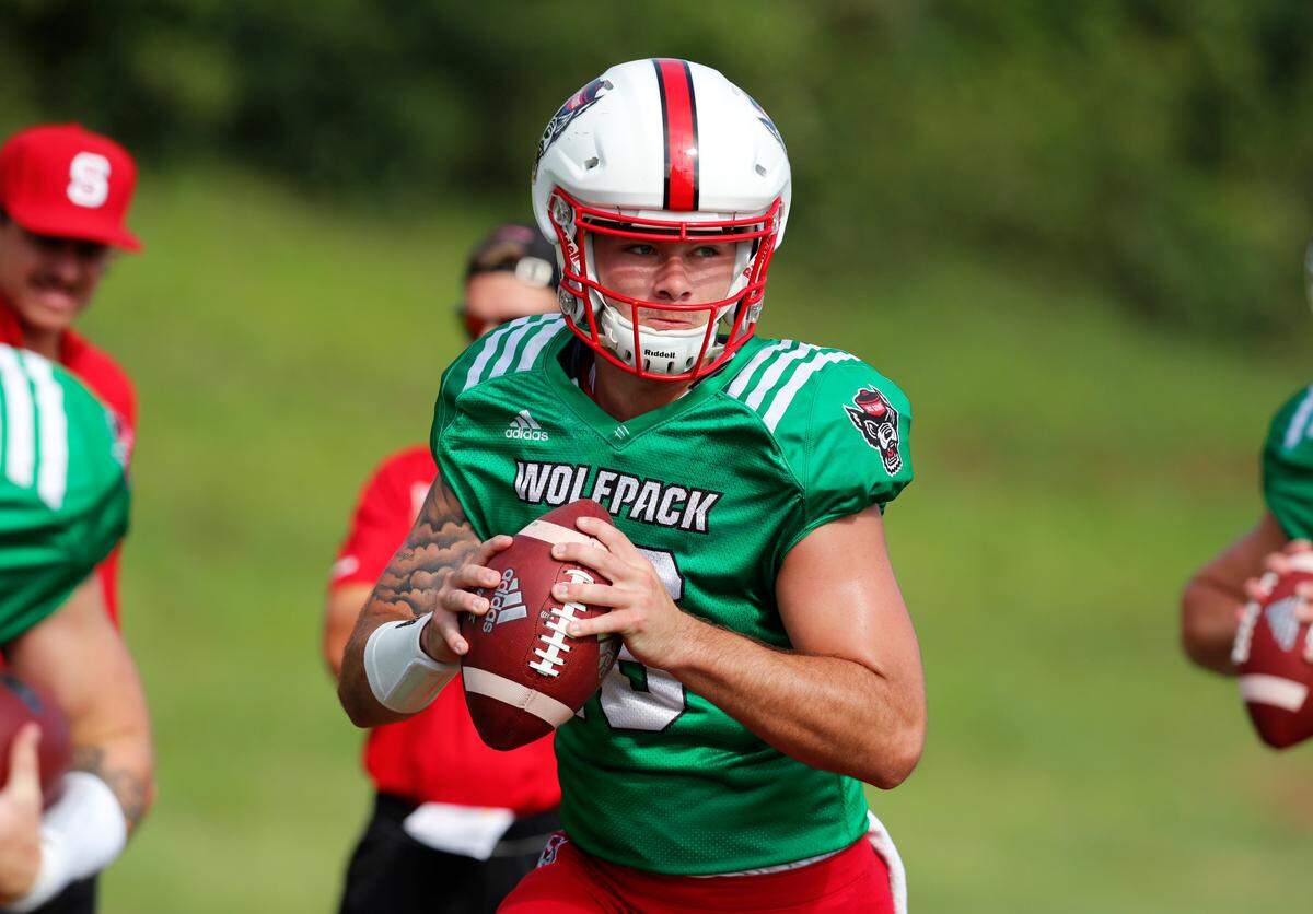 N.C. State quarterback Bailey Hockman (16) runs through drills during the Wolfpack’s practice in Raleigh, N.C. Tuesday, August 6, 2019.