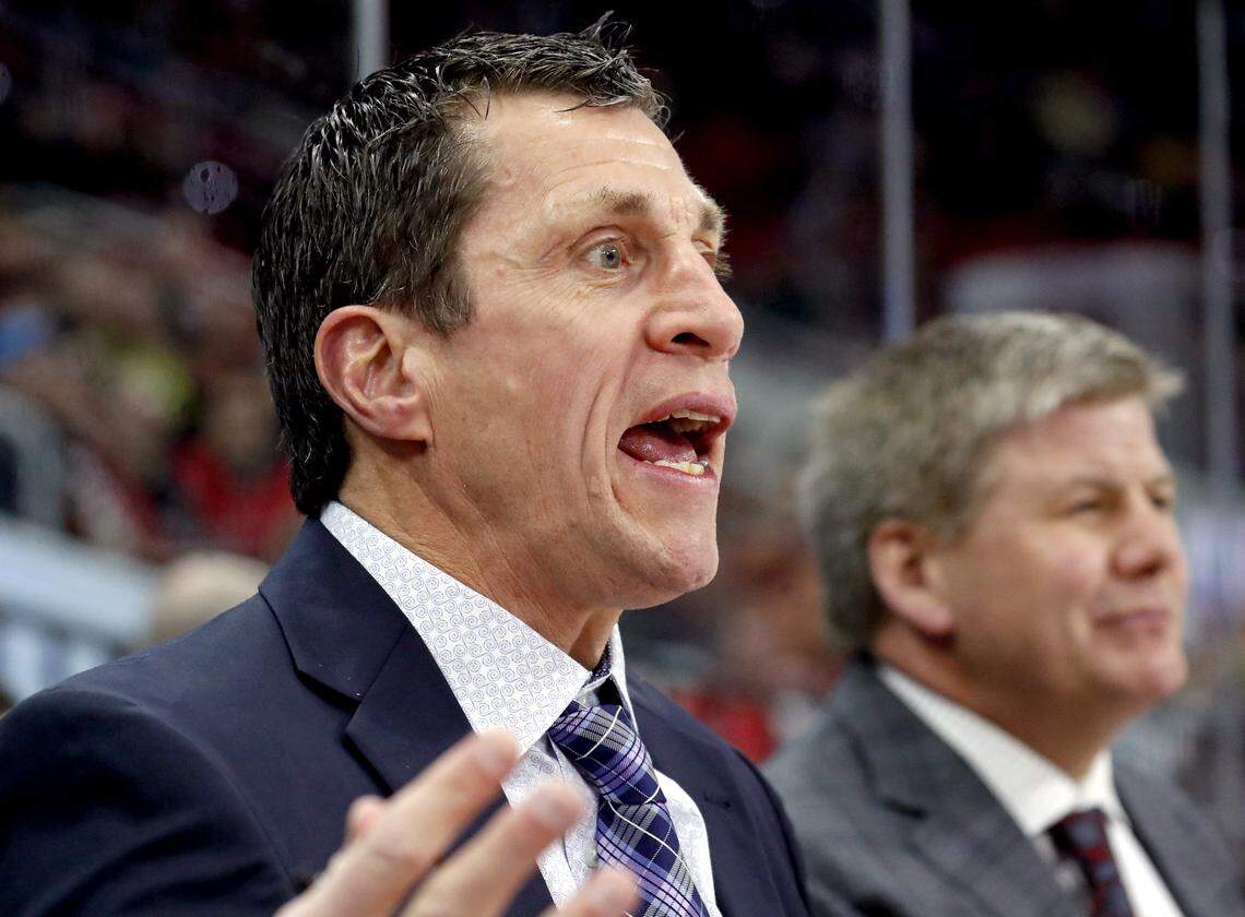 The Canes' assistant coach Rod Brind'Amour, left, argues a ruling of an Arizona goal by an official during a 2018 game.