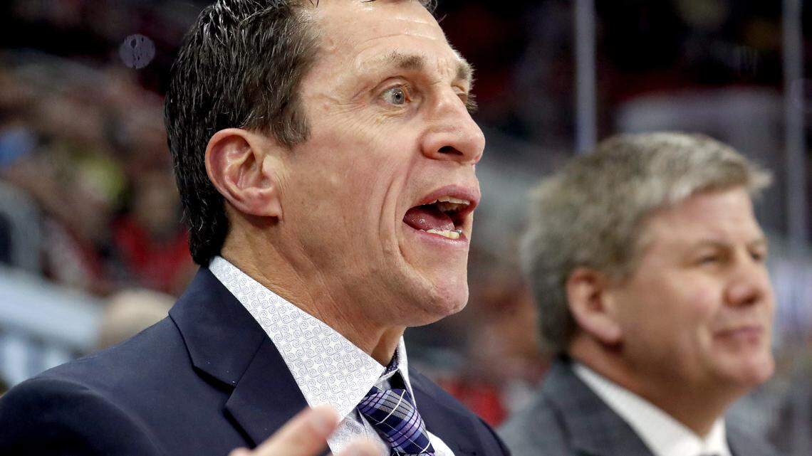 The Canes' assistant coach Rod Brind'Amour, left, argues a ruling of an Arizona goal by an official during a 2018 game.