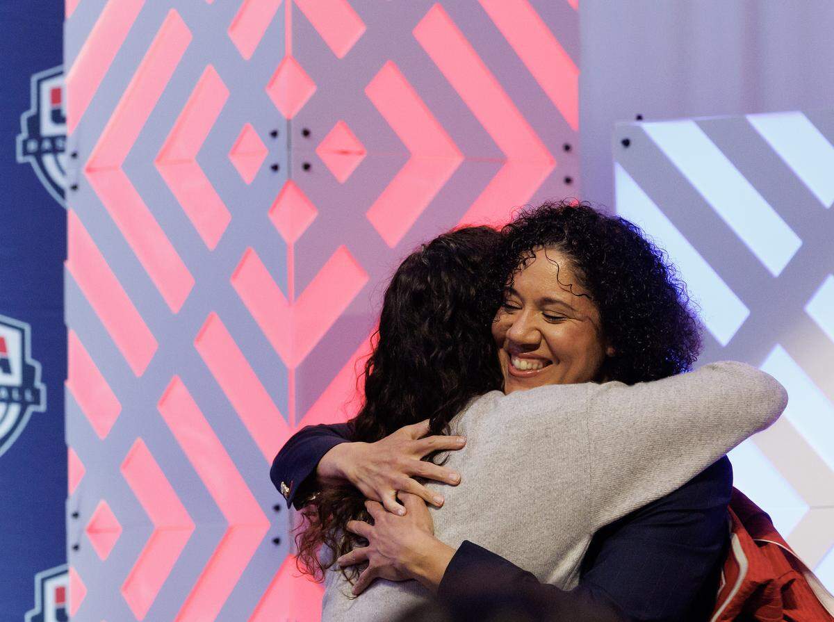Duke women’s basketball head coach Kara Lawson hugs Sue Bird after being named the 2025-2028 USA Basketball Women’s National Team head coach during a ceremony at Cameron Indoor Stadium on Tuesday, Sept. 23, 2025, in Durham, N.C.