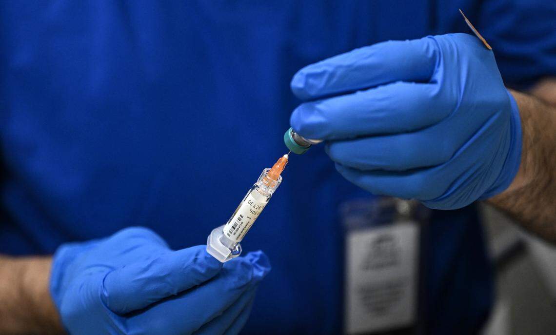 A health worker prepares a dose of the measles vaccine at a health center in Lubbock, Texas, on February 27, 2025.