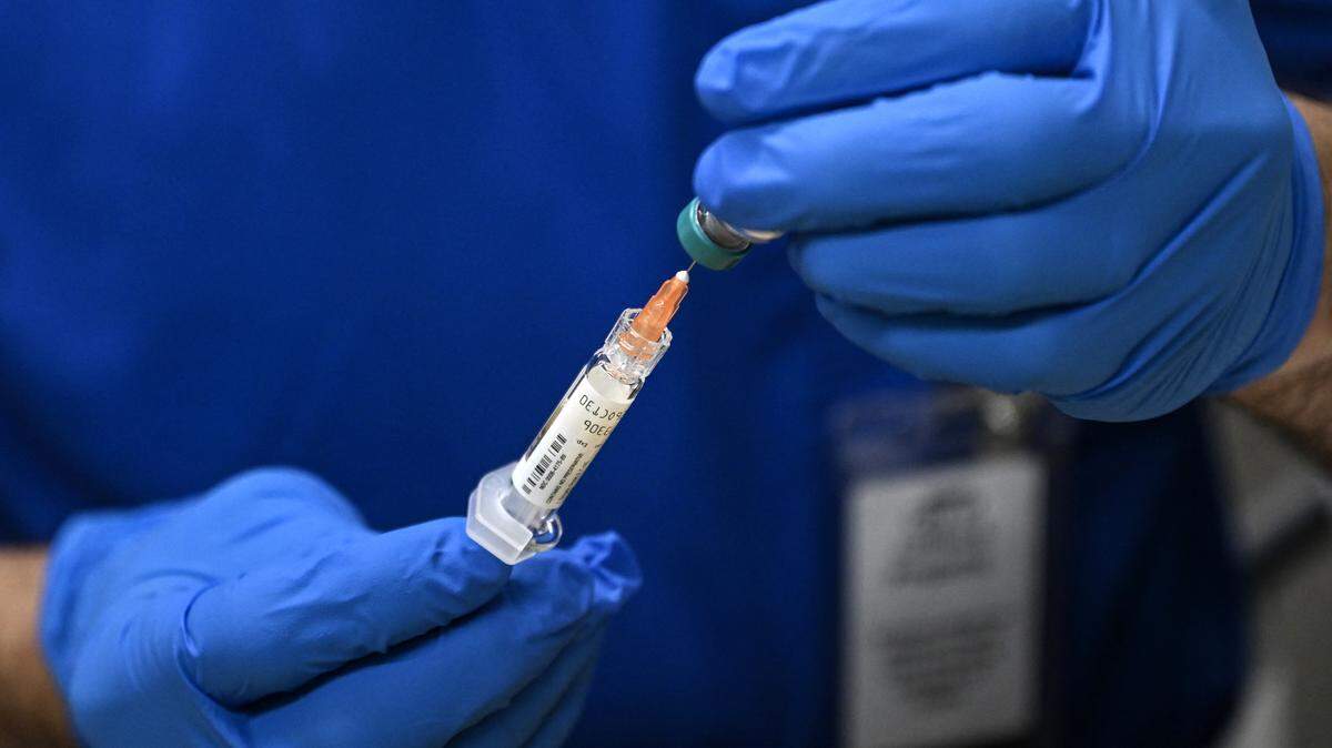 A health worker prepares a dose of the measles vaccine at a health center in Lubbock, Texas, on February 27, 2025. 