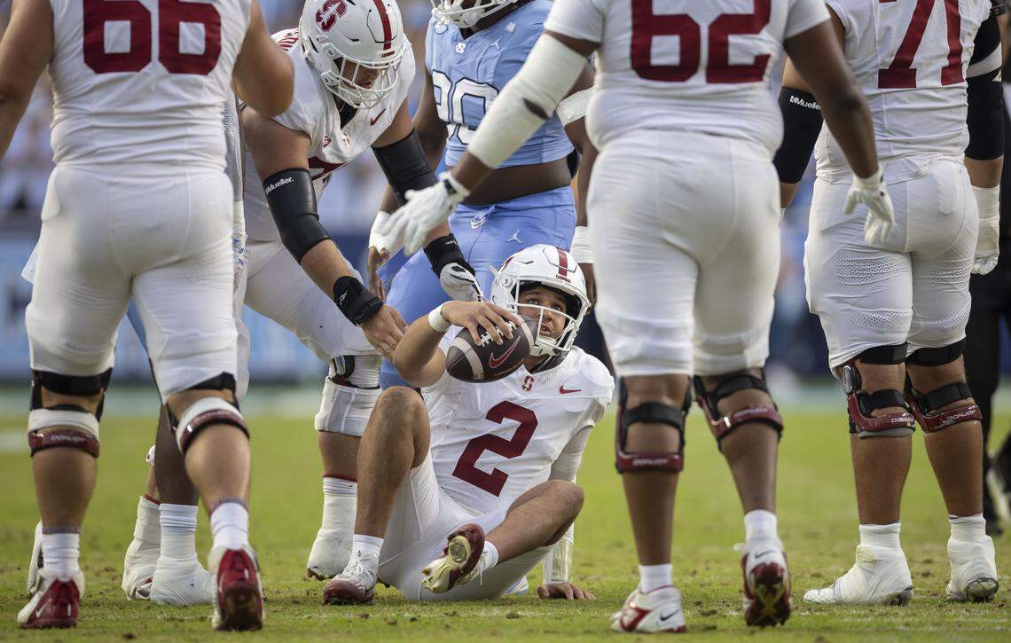 Stanford quarterback  Elijah Brown (2) looks to his linemen after being sacked for an eight yard loss in the first quarter by North Carolina linebacker Tyler Thompson (40) on Saturday, November 8, 2025 at Kenan Stadium in Chapel Hill, N.C.
