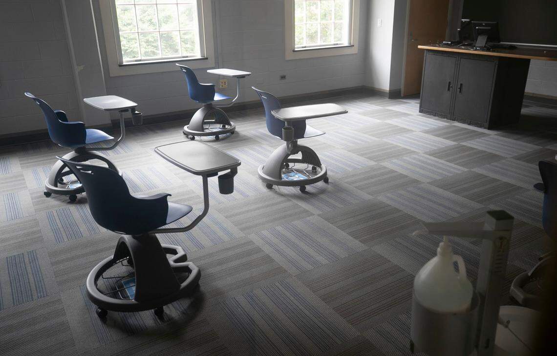 A socially distanced classroom with a hand sanitizer dispenser in Dey Hall on the University of North Carolina campus on Thursday, August 20, 2020 in Chapel Hill, N.C. Despite the university’s best efforts to open safely amid the COVID-19 virus, all classes were moved to online this week after several clusters of the virus were found on campus.