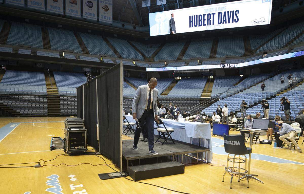 Hubert Davis steps the dais to ‘Roy Williams Court’ following his introduction at the new men’s basketball coach at the University of North Carolina on Tuesday, April 6, 2021 at the Smith Center in Chapel Hill, N.C. 