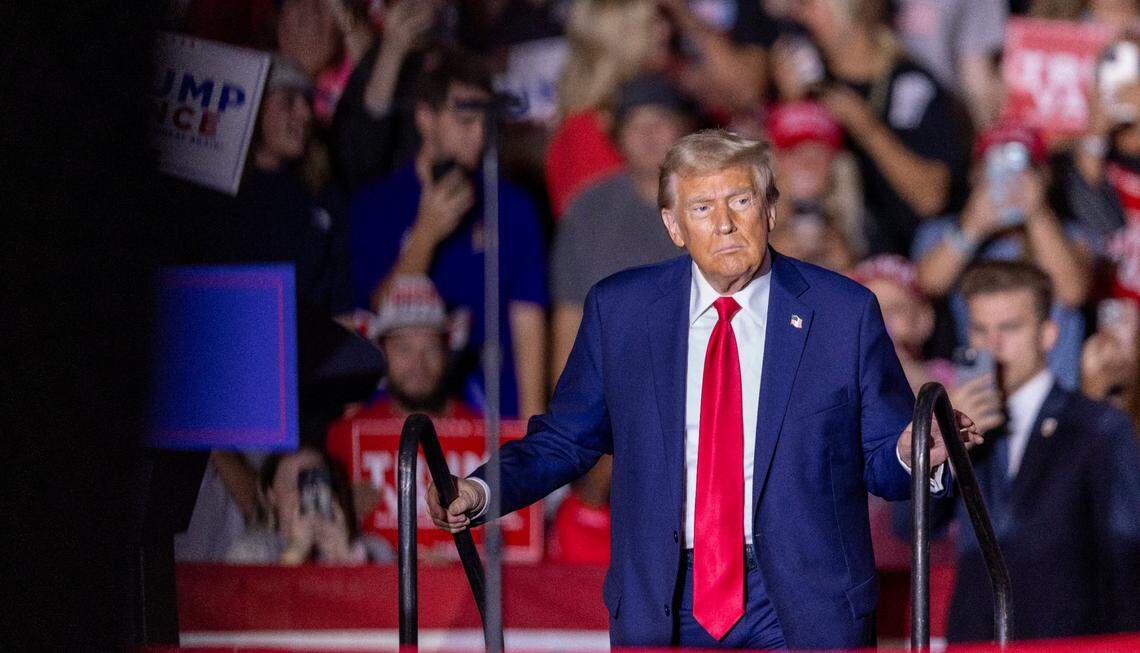 Former President Donald Trump takes the stage during a rally at Minges Coliseum in Greenville on Monday, Oct. 21, 2024. With two weeks until Election Day, Trump went on a three-city tour, in which Trump will also see the destruction caused by Hurricane Helene in Asheville and speak at a faith conference in Concord.