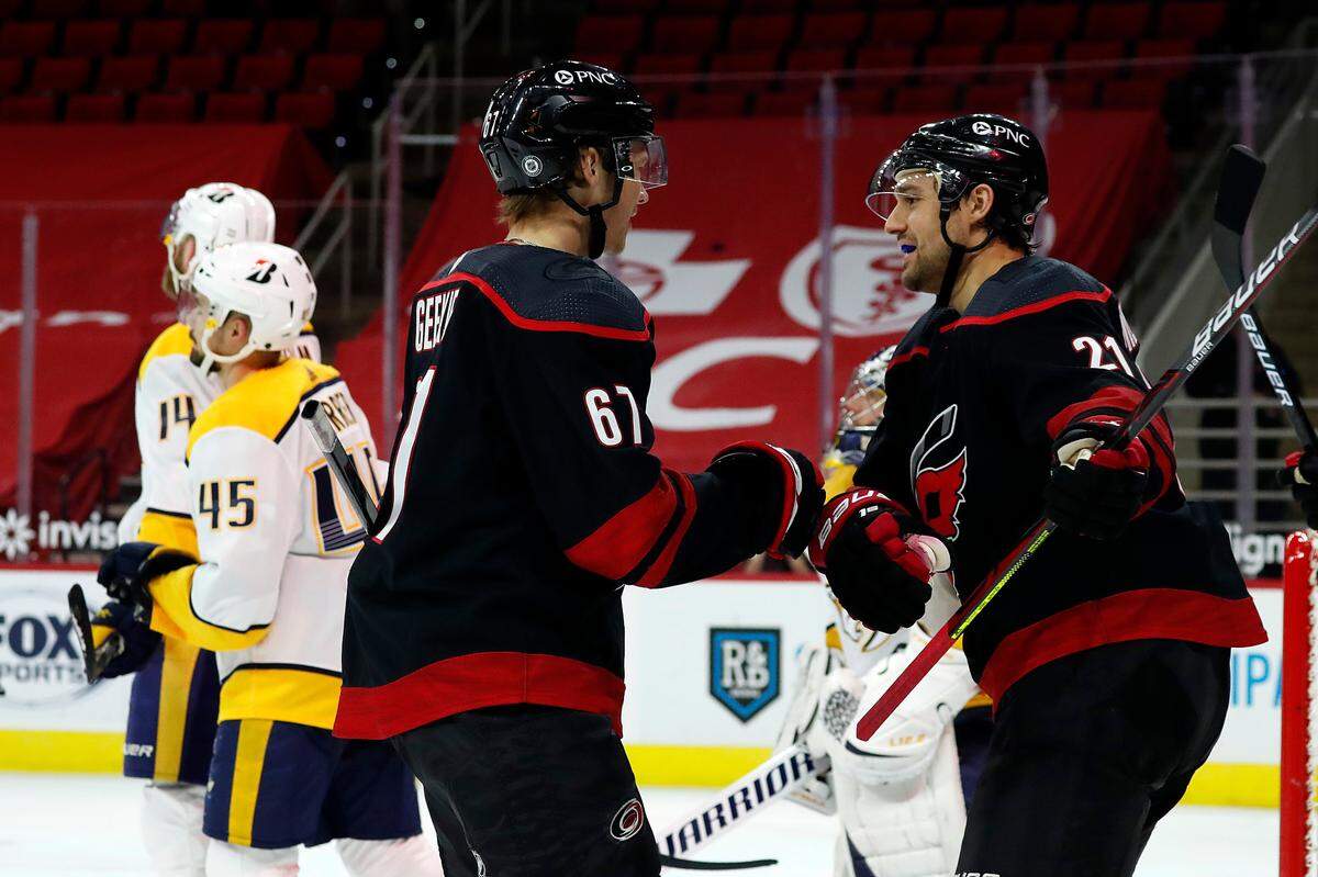 Carolina Hurricanes’ Morgan Geekie (67) is congratulated by Nino Niederreiter (21) after his second goal of the night, during the second period of the team’s NHL hockey game against the Nashville Predators in Raleigh, N.C., Thursday, March 11, 2021. (AP Photo/Karl B DeBlaker)