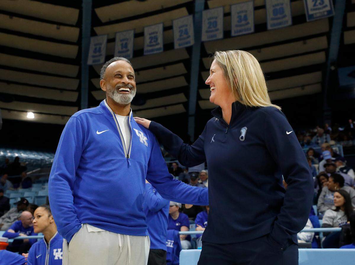 Kentucky head coach Kenny Brooks and North Carolina head coach Courtney Banghart share a laugh prior to the Tar Heels’ game against the Wildcats on Thursday, Dec. 5, 2024, at Carmichael Arena in Chapel Hill, N.C.