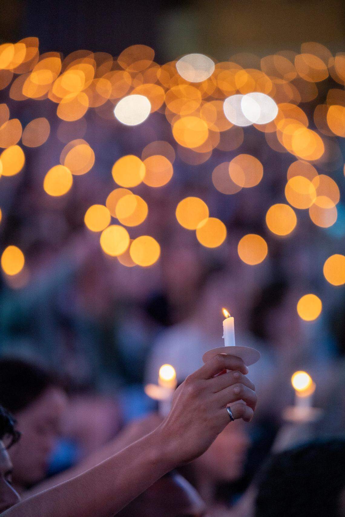 UNC-Chapel Hill students, faculty and family hold a candlelight vigil Friday, Aug 30, 2023 at the Dean Smith Center in honor of professor Zijie Yan who was shot and killed on campus on Monday.