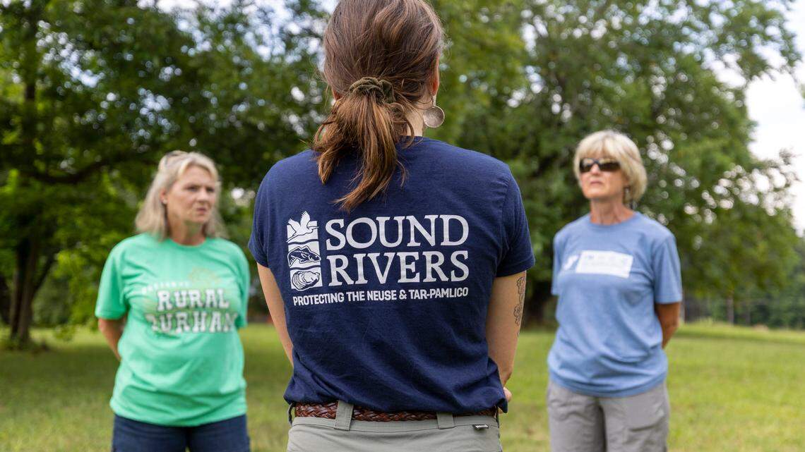 Neuse Riverkeeper Samantha Krop talks with concerned residents, Pam Andrews, left and Wanda Allen before taking water samples from Lick Creek on Friday, July 8, 2022 in Durham, N.C. Krop told Durham City Council that turbidity in the creek is higher than state standards during a Thursday presentation.